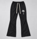 Black Palm Tree Sweatpants, White Paint Drip Graphic, Flared Raw Hem Pants