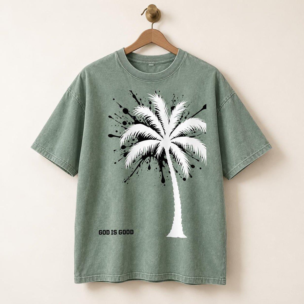 Sage Green Oversized Palm Tree Tee, Black Splatter Graphics, "God Is Good" Statement